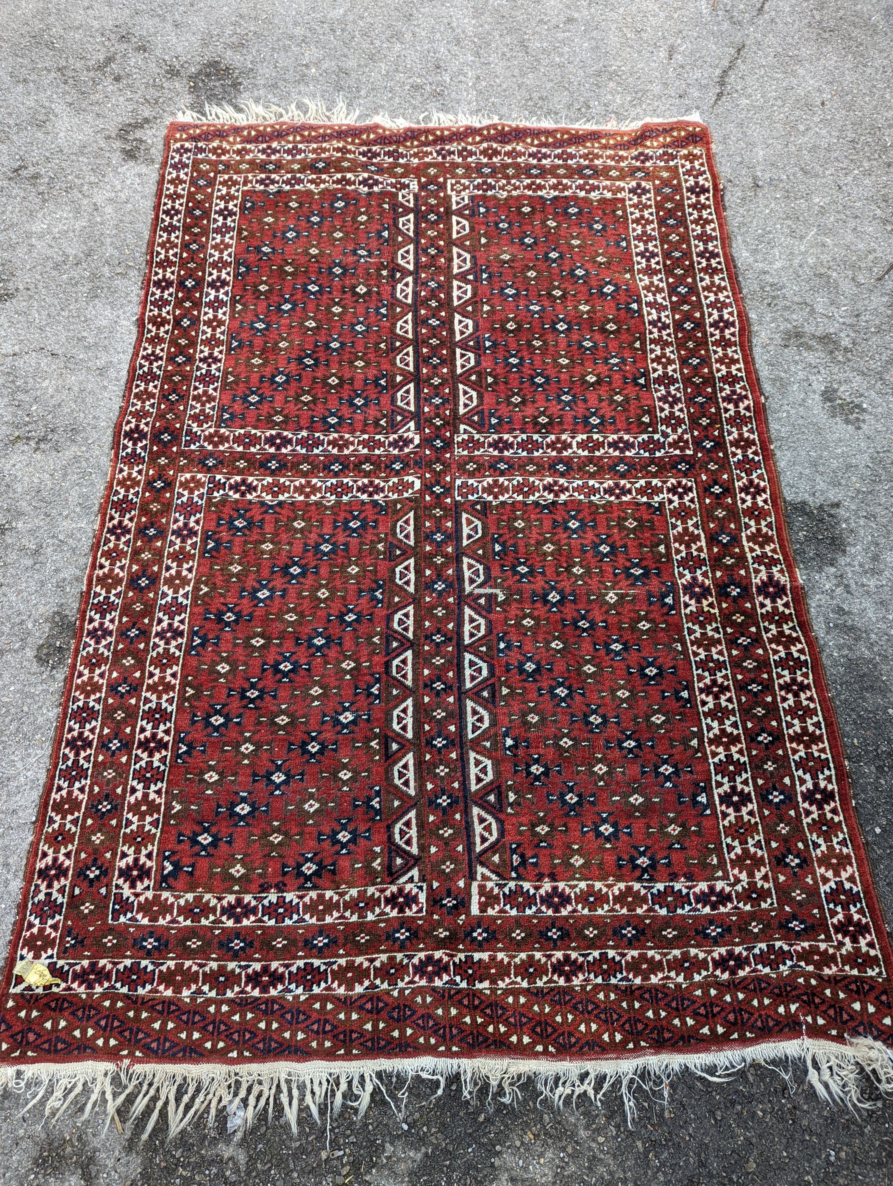 A Belouch red ground rug, 200 x 130cm